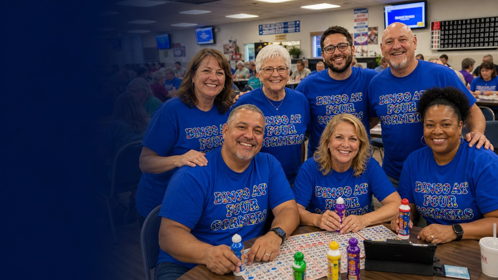 Friendly AI-generated Bingo At Four Corners players wearing royal blue logo shirts in a bingo hall